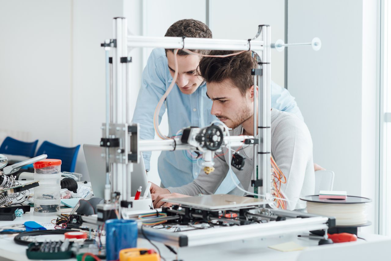 young-researchers-and-3d-printer-PHP3QEH
